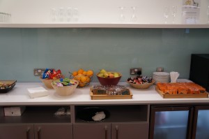 a counter with fruit and snacks