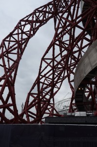 a red metal structure with a circular structure