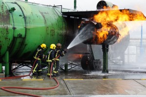 firefighters spraying water on a fire
