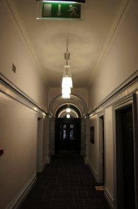 a hallway with a light from the ceiling