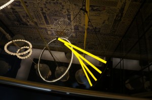 a yellow light from a ceiling