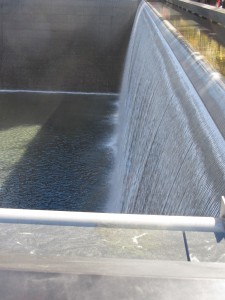 a water fall over a dam