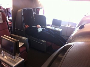 a person sleeping in an airplane seat