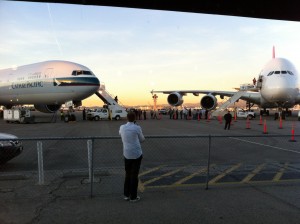 a man standing in front of two airplanes