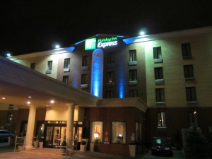 a hotel front with lights at night
