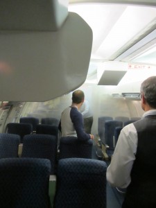 a man standing in an airplane