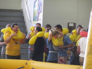 a group of people wearing yellow floaties