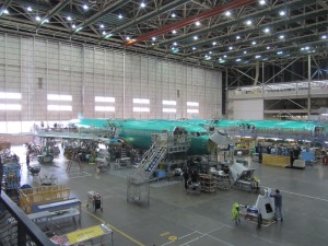 an airplane factory with many workers