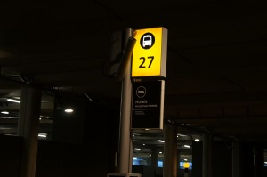 a yellow sign with a number and a black and white sign