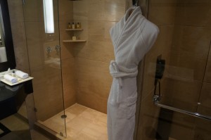 a white robe on a shower