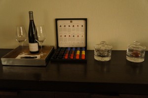 a wine bottle and wine glass on a table