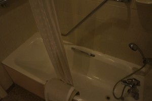 a bathtub with a shower curtain