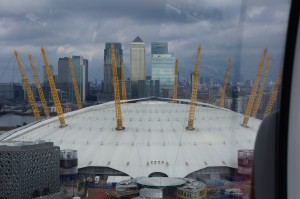 a large white dome with yellow cranes on top