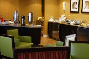 a room with a buffet and a coffee pot