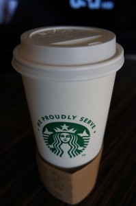 a white coffee cup with a lid