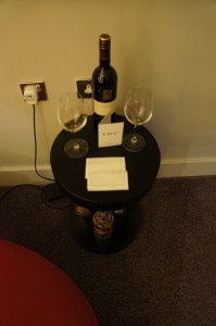 a wine bottle and glasses on a table