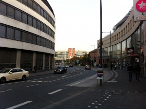 a street with cars and buildings