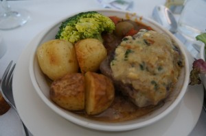a bowl of food with broccoli and potatoes