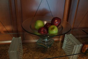 a bowl of apples on a counter