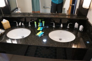 a bathroom sink with a couple of white sinks