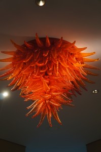 a chandelier with orange glass