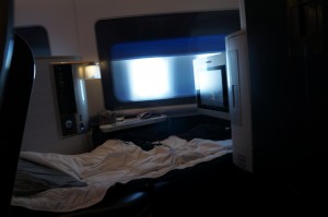 a bed with a tv in the corner