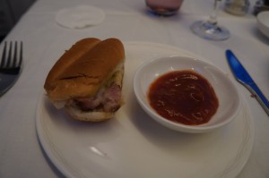 a sandwich and sauce on a plate