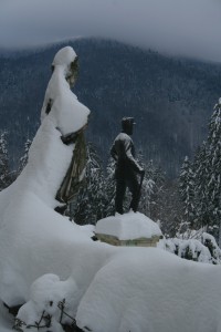 a statue of a man in the snow