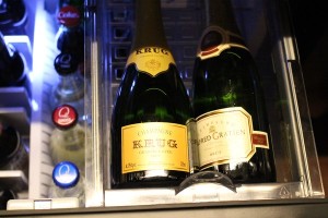 two bottles of champagne on a shelf