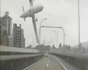 a plane flying over a road
