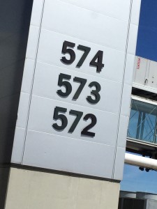 a white rectangular sign with black numbers on it