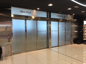 a glass doors with signs on them