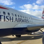 a large airplane with blue and white text on it