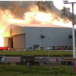a large building with smoke coming out of it