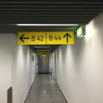 a hallway with signs and arrows