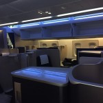 an airplane cabin with seats and a light