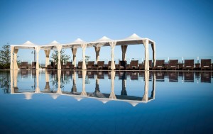 a pool with a white canopy over it