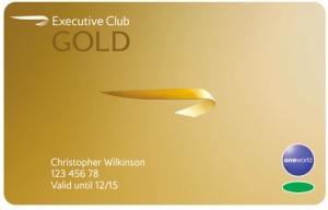 a business card with a gold ribbon