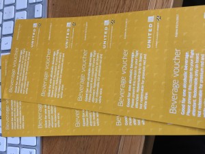 a stack of yellow paper vouchers