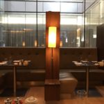 a table with a lamp in a restaurant