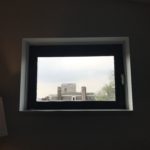 a window with a building outside