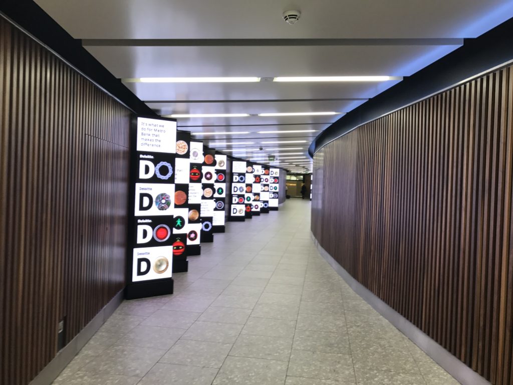 a hallway with signs on the wall