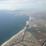 an aerial view of a beach and land