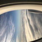 view of clouds and sky from an airplane window