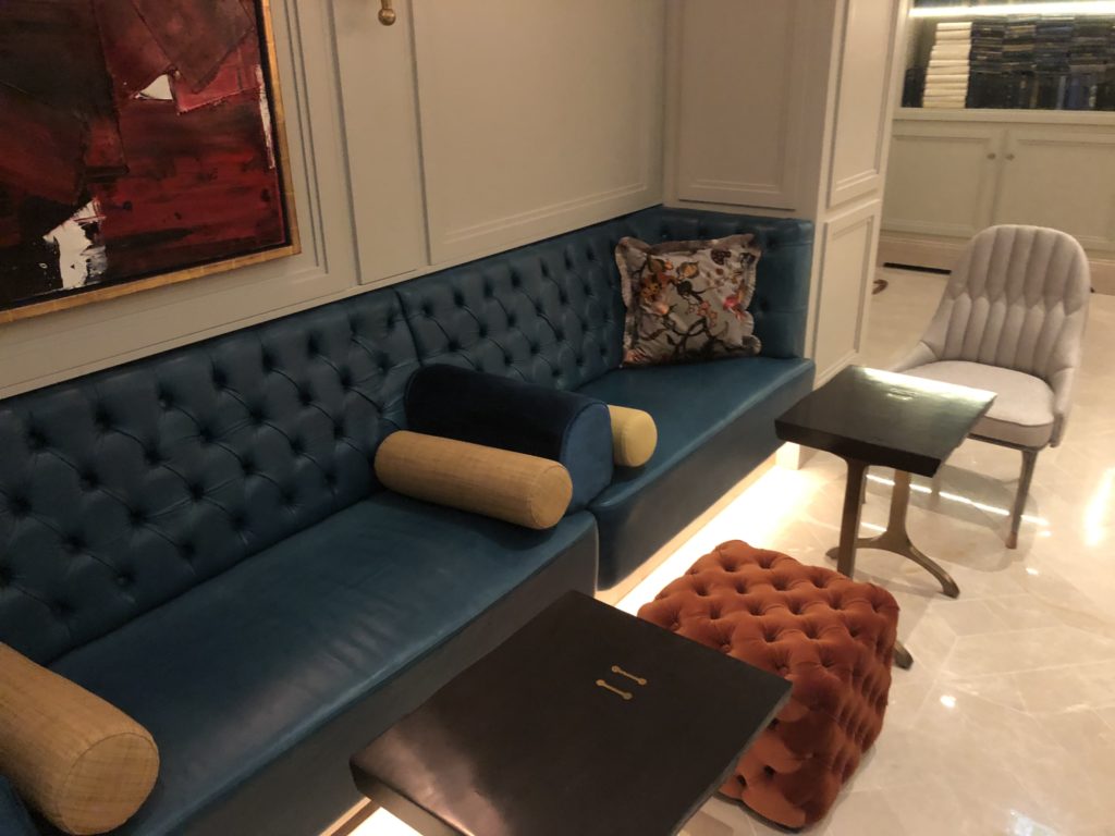 a couch with pillows in a room