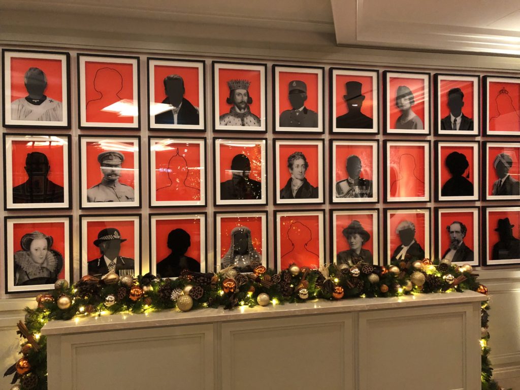 a wall with pictures of people